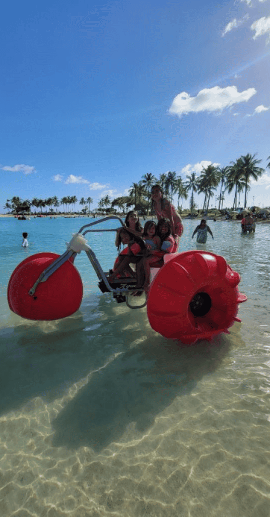 Kids riding a water tricycle